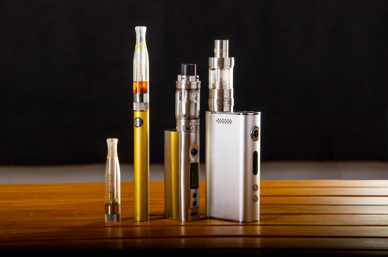 vape devices and electronic cigarette, ecig and mods over a black background.