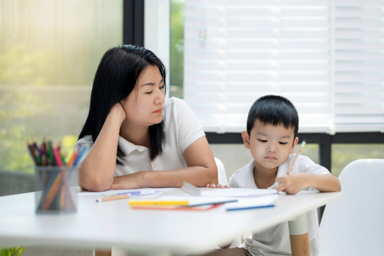 Mother,And,Son,Doing,Homework,At,Home,,Mother,Is,Teaching
