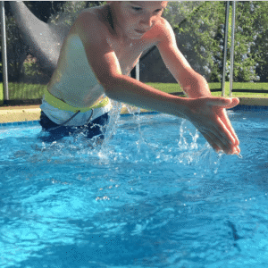 child-diving-inside-swimming-pool-water-young-boy-kid-dives-into-clear-water-SBI-351589702-1